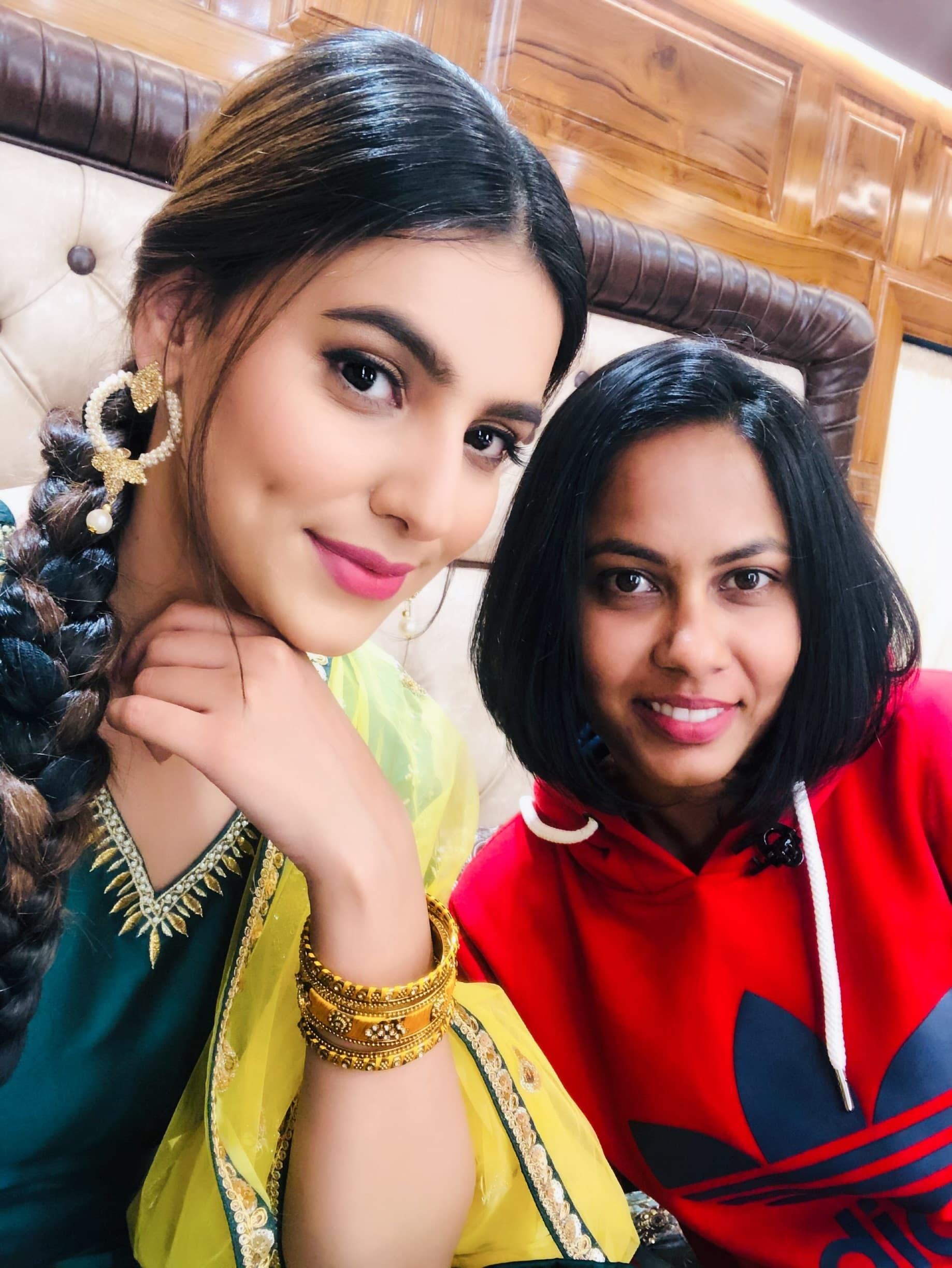 Anthéa with an actress styled in traditional wear for a shoot