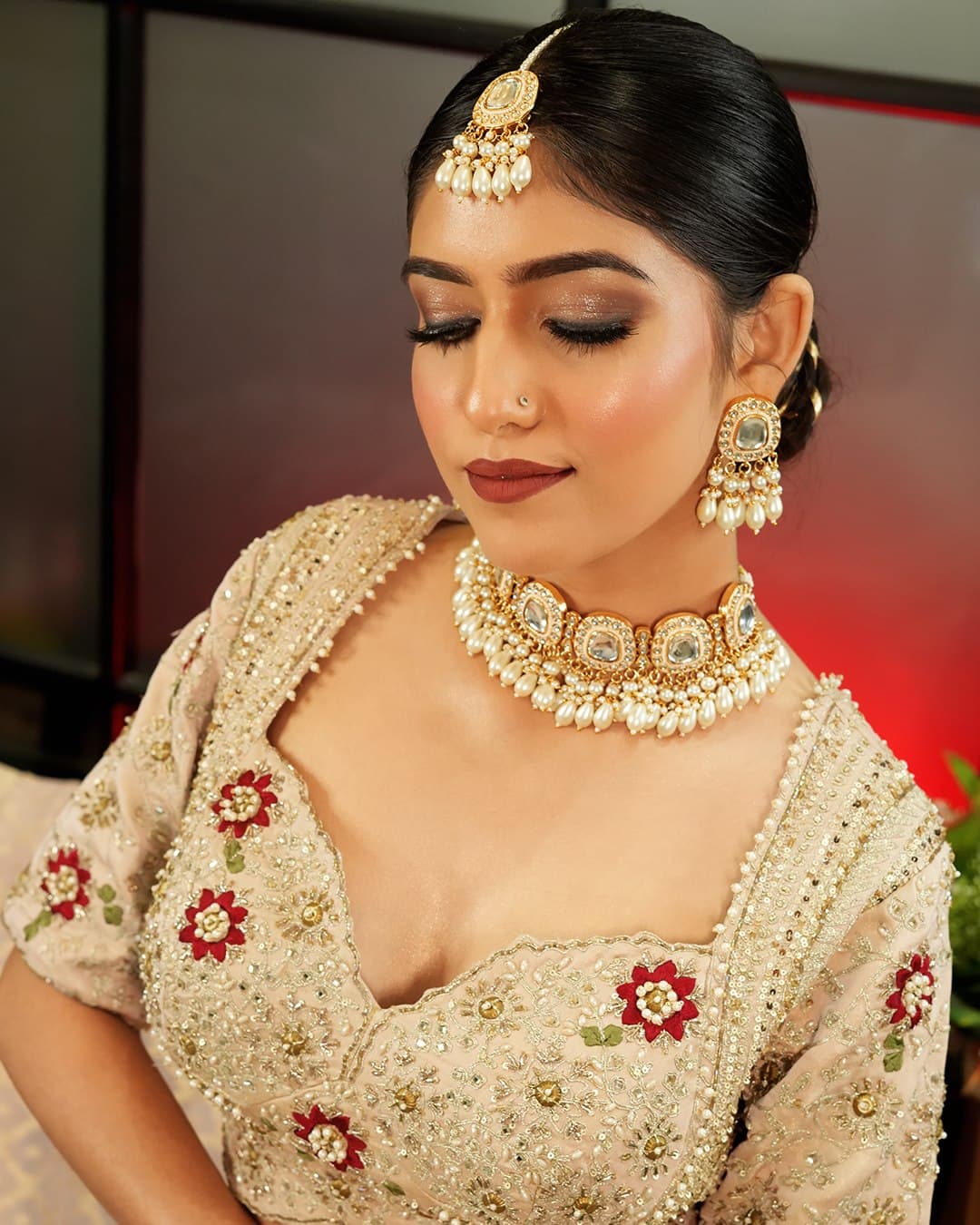 An ivory and gold look finished with a kundan choker