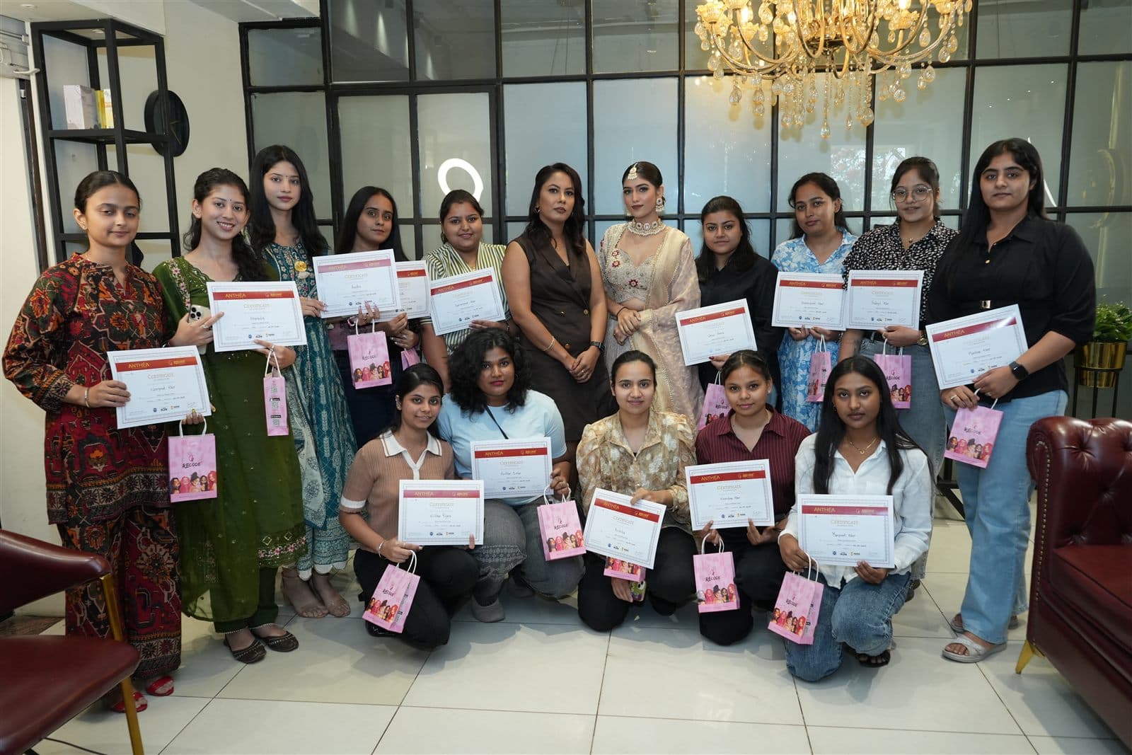 Anthéa Academy students holding their course certificates at the studio