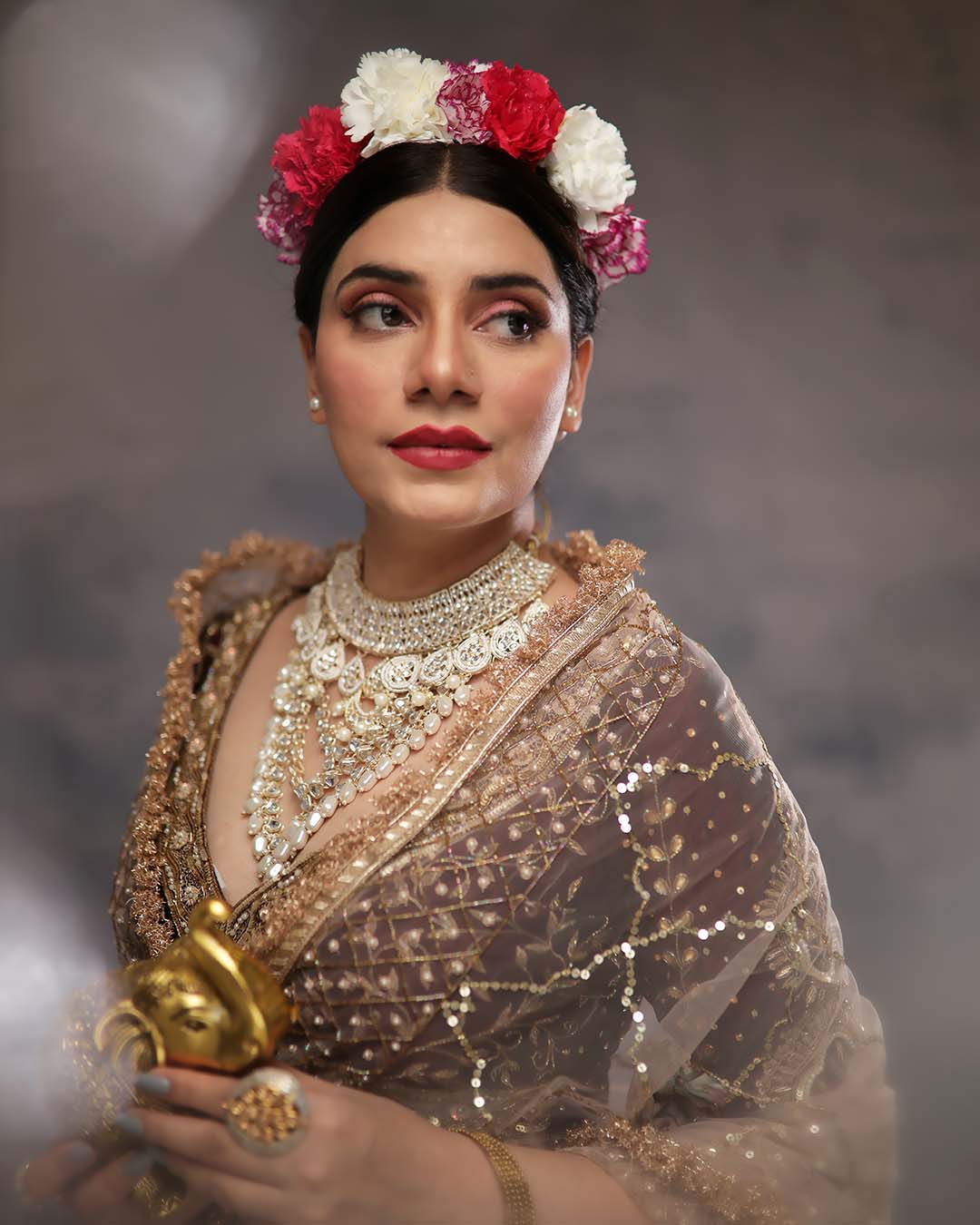 An editorial makeup look finished with a fresh flower crown